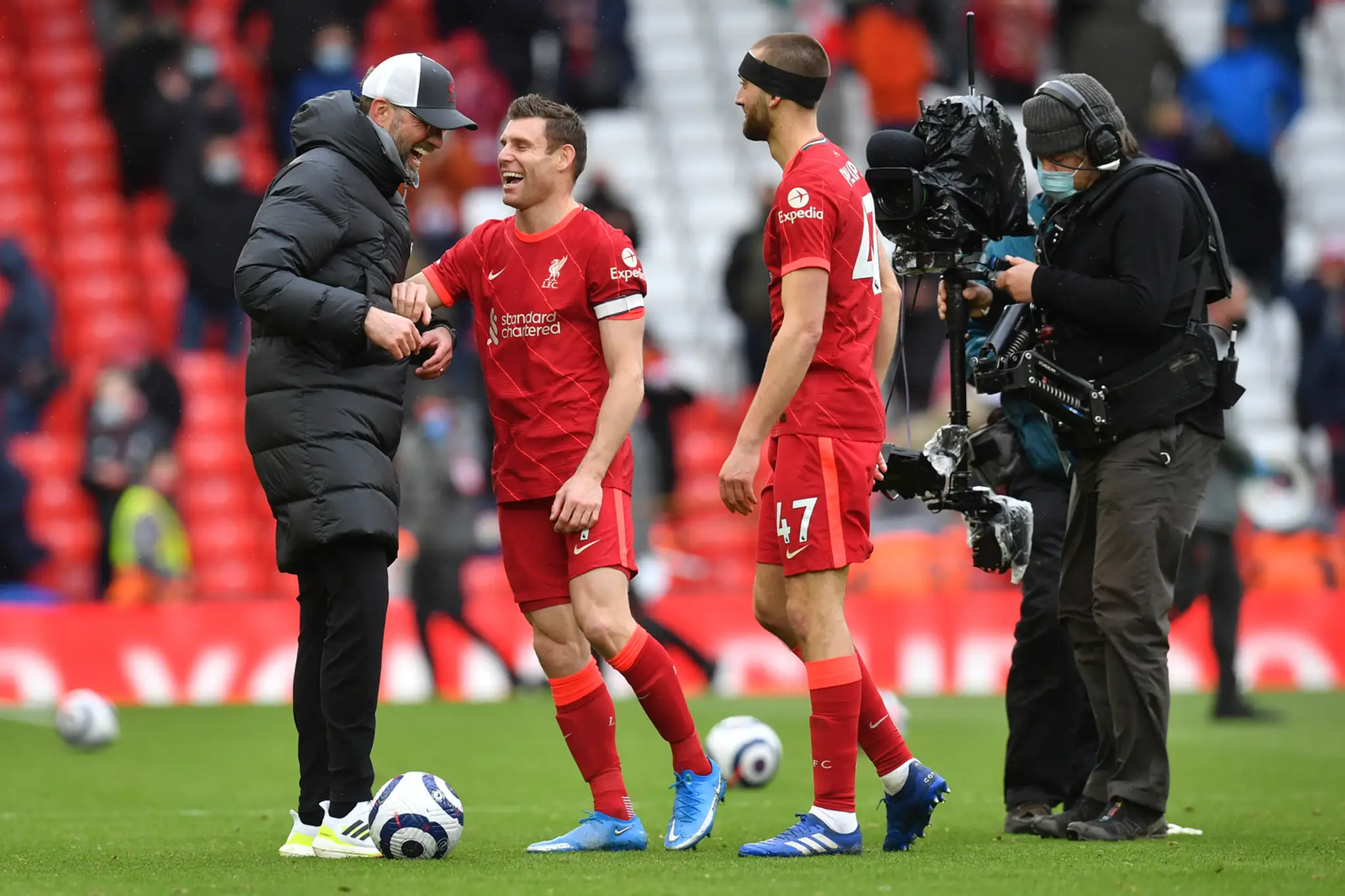 Klopp a Milner sa tešia z postupu do LM.
