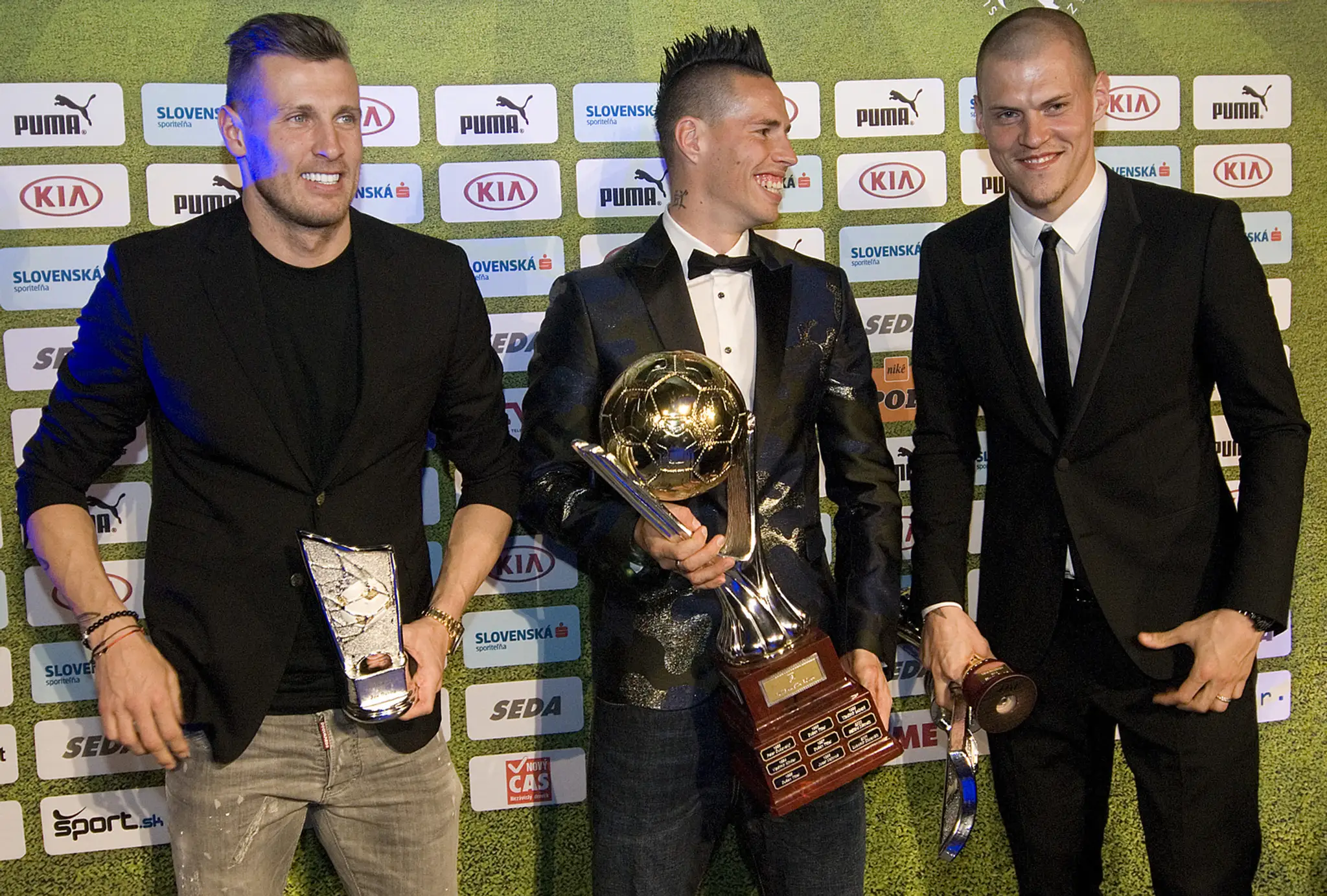 Traja najlepší futbalisti roka 2014 zľava Ján Ďurica, víťaz Marek Hamšík a Martin Škrtel.