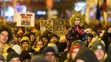 Protestujúci s transparentmi v Bratislave