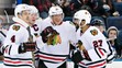  Hráči Chicaga Niklas Hjalmarsson (4), Jonathan Toews (19), Marián Hossa (81) a Johnny Oduya (27).