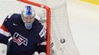 Na snímke dole Andrej Meszároš (Slovensko) a brankár Connor Hellebuyck (USA)