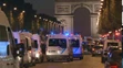 Na snímke policajné autá sú na bulvári Champs-Élysées v centre francúzskeho hlavného mesta Paríž, kde došlo k streľbe.