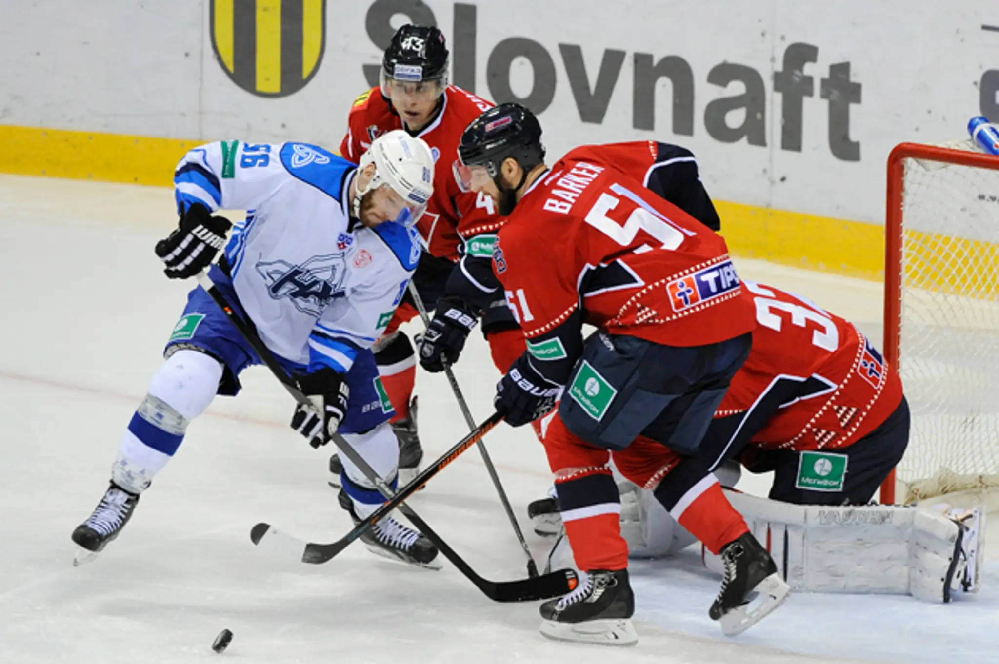 Andrej Ivanov (Nižnekamsk), Tomáš Surový, Cam Barker a brankár Jaroslav Janus (všetci Slovan).