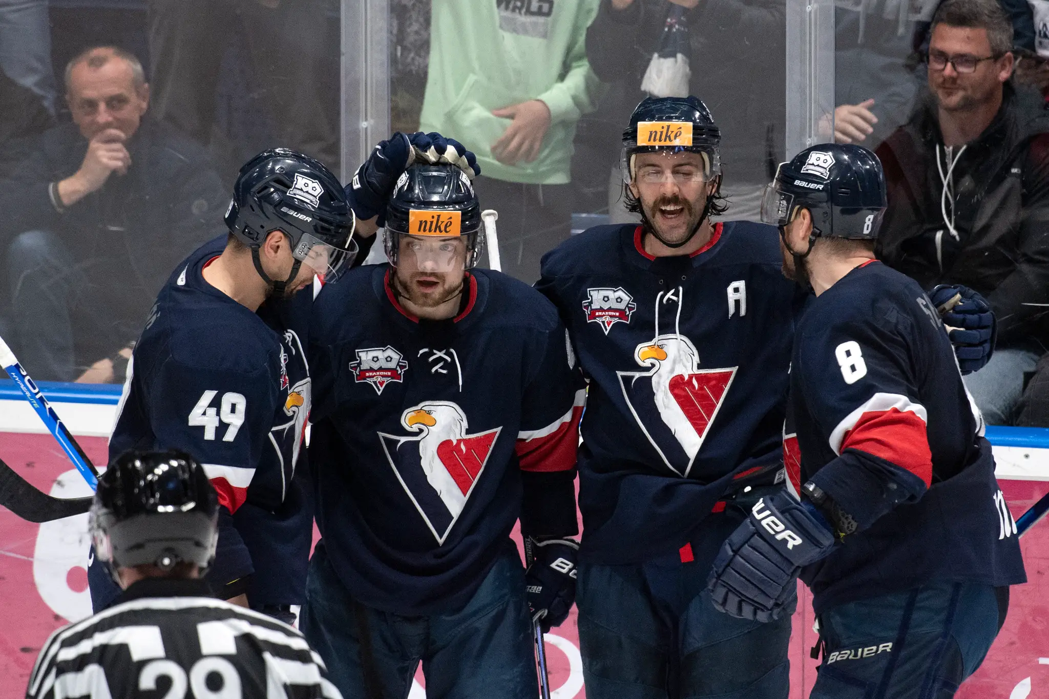 Zľava Samuel Takáč, Daniel Gachulinec, Brant Harris a Michal Sersen (Slovan) po strelení gólu v druhom semifinále Tipos extraligy s Košicami.