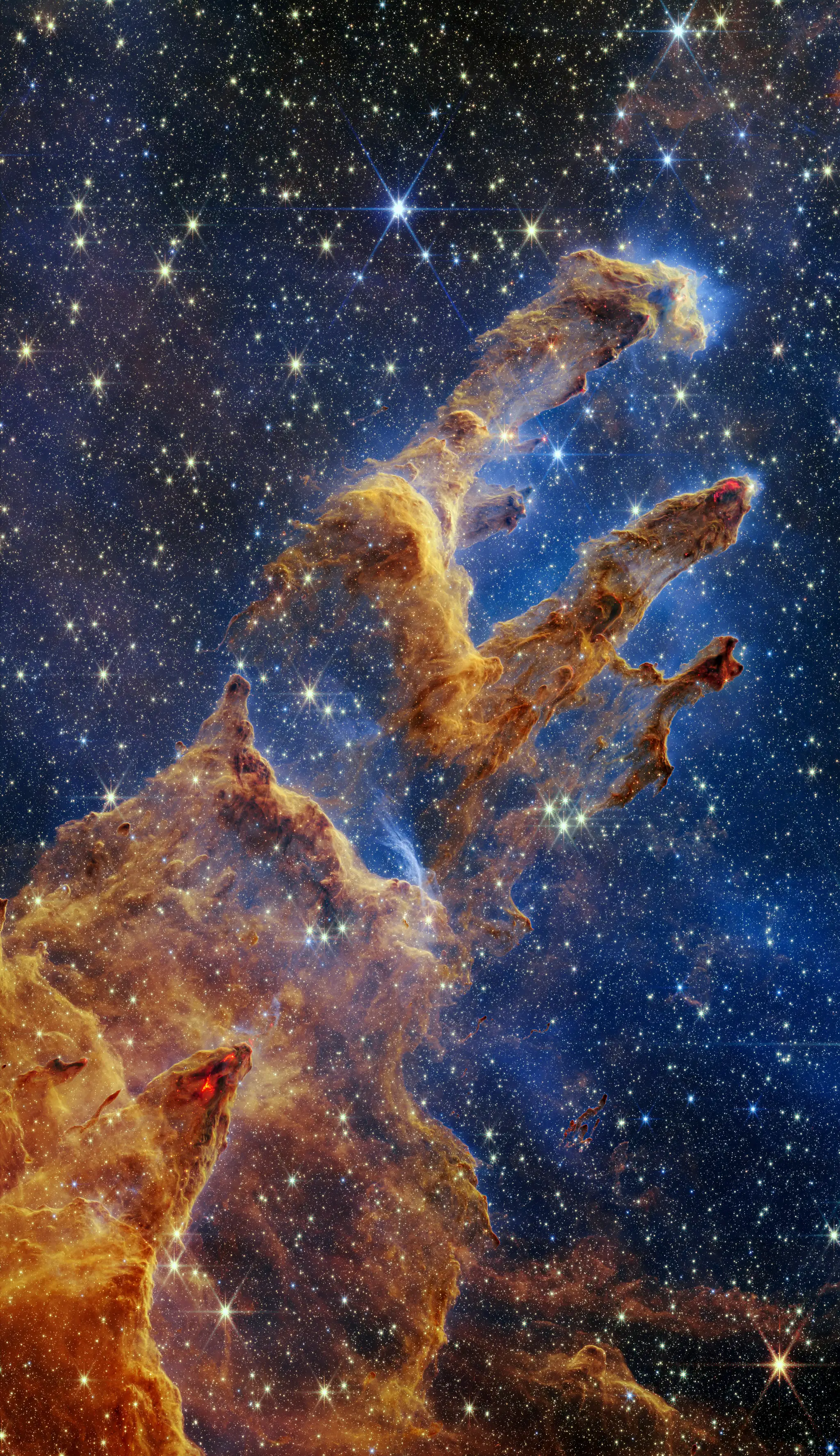 Na snímke poskytnutej americkým Národným úradom pre letectvo a vesmír (NASA) 19. októbra 2022 sú Stĺpy stvorenia ako súčasť Orlej hmloviny zachytené vesmírnym teleskopom Jamesa Webba v takmer infračervenom svetle.