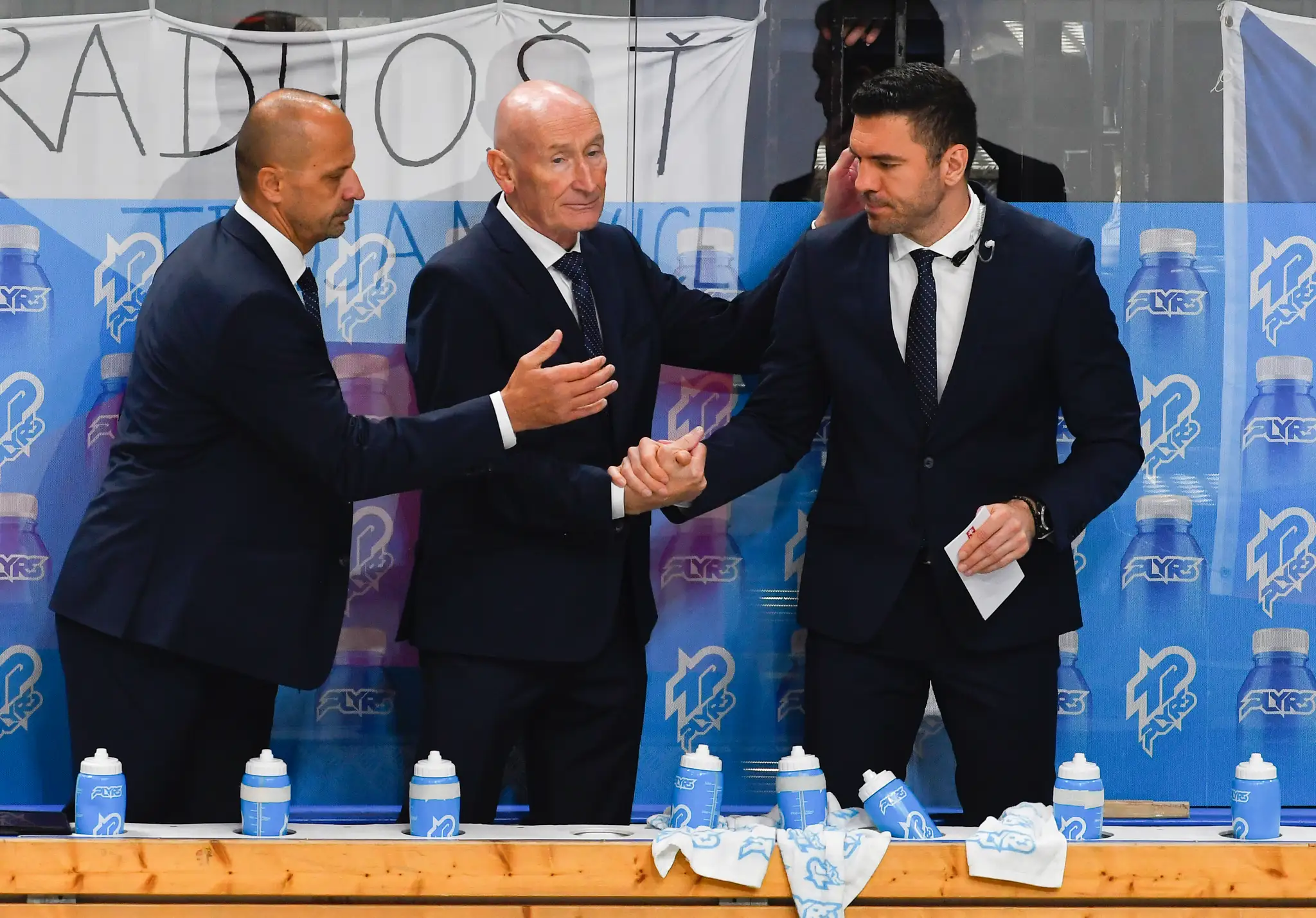 Na snímke zľava asistent hlavného trénera Ján Pardavý, tréner hokejistov Slovenska Craig Ramsay a asistent trénera Peter Frühauf.