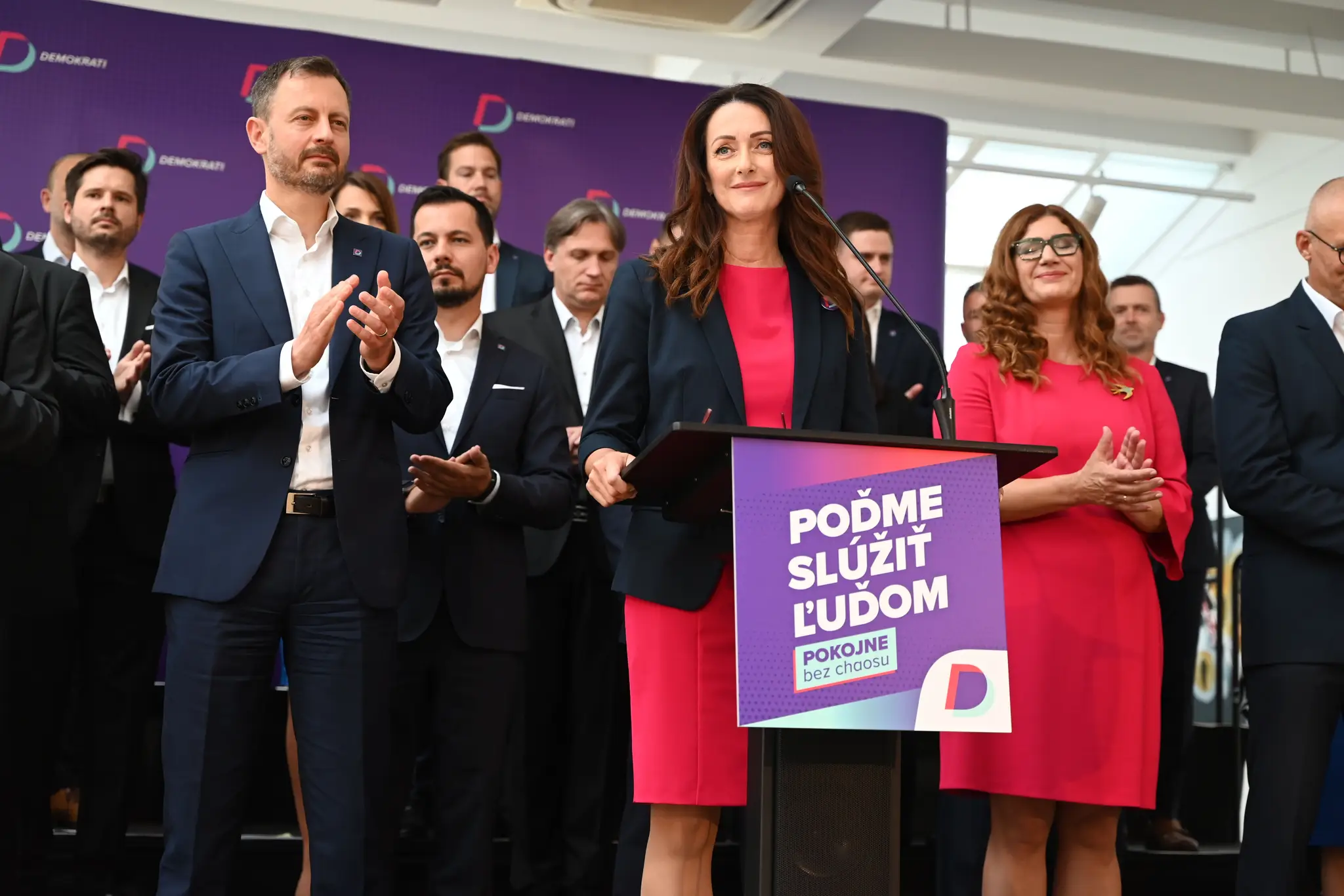 Na snímke Andrea Letanovská, Eduard Heger a členovia strany Demokrati.