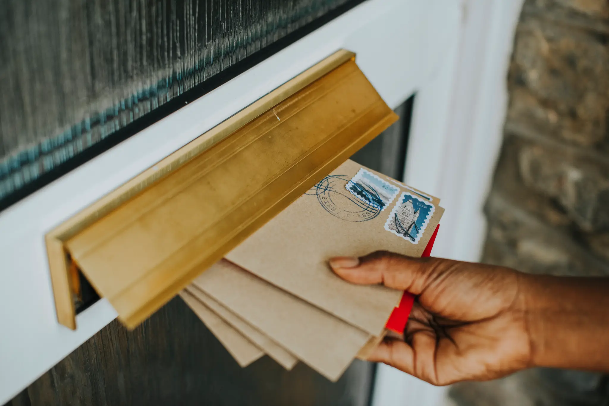woman-picking-up-mail