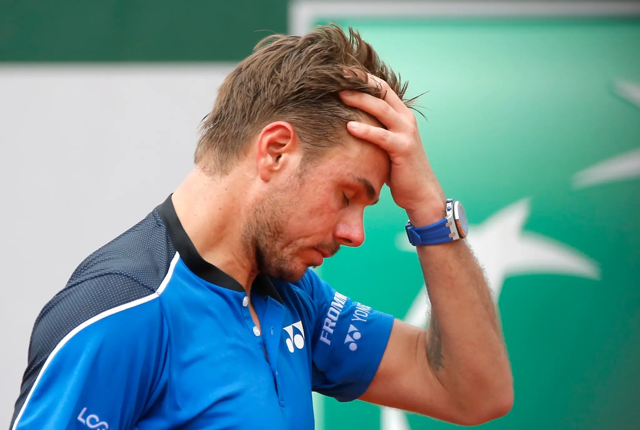 Stan Wawrinka v zápase proti Španielovi Guillermovi Garciovi-Lopezovi v 1. kole dvojhry na grandslamovom turnaji Roland Garros.