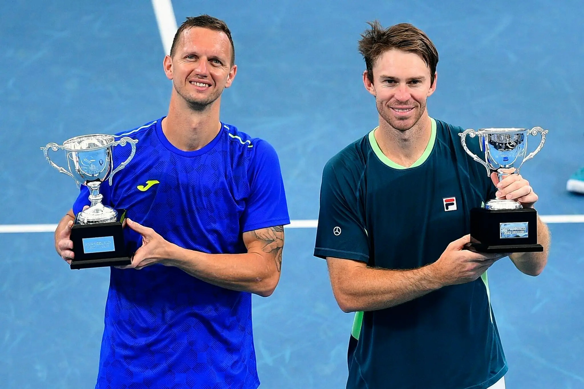 Polášek s Peersom po triumfe na turnaji v Sydney. (15. január)