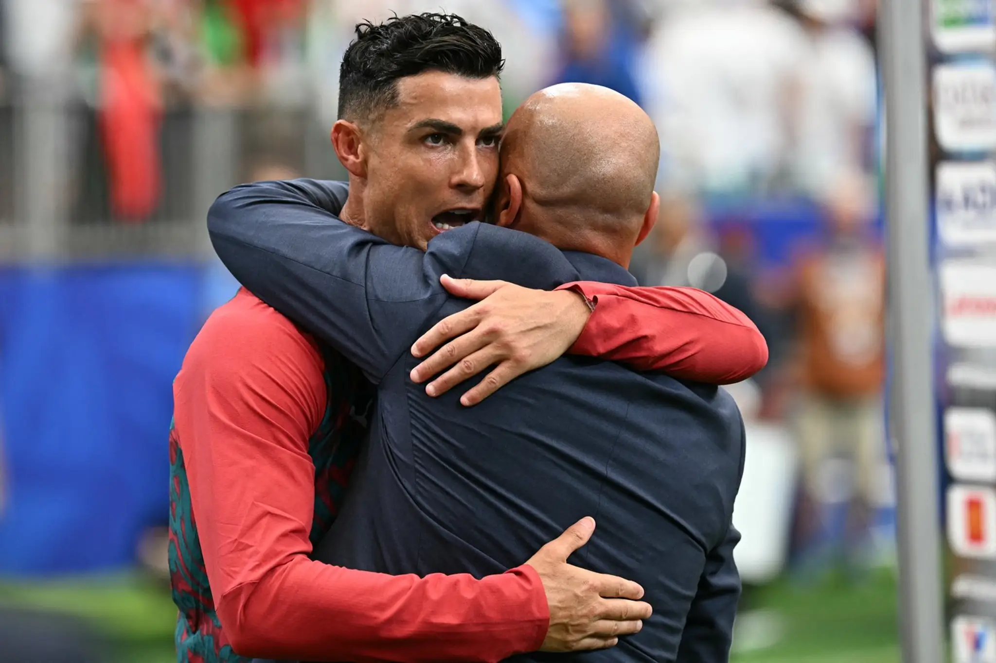 Cristiano Ronaldo a tréner Roberto Martinez.