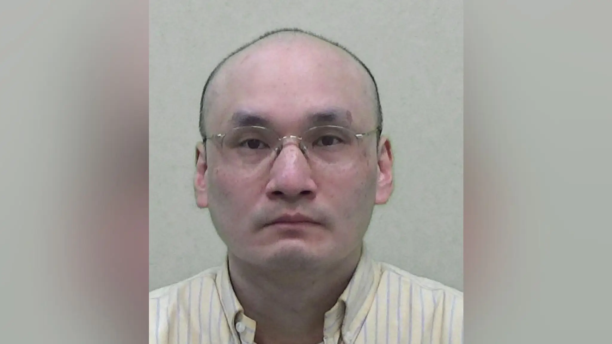 Thomas Kwan na policajnej snímke.