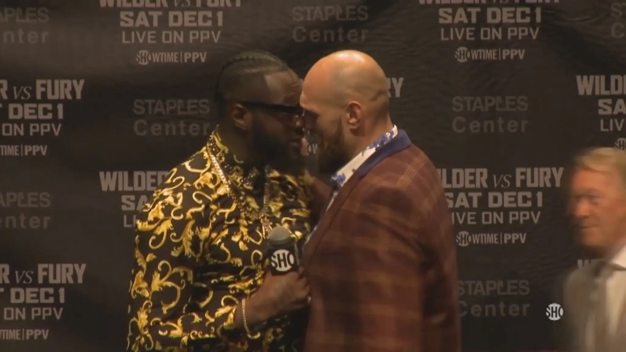 Deontay Wilder a Tyson Fury tvárou v tvár.