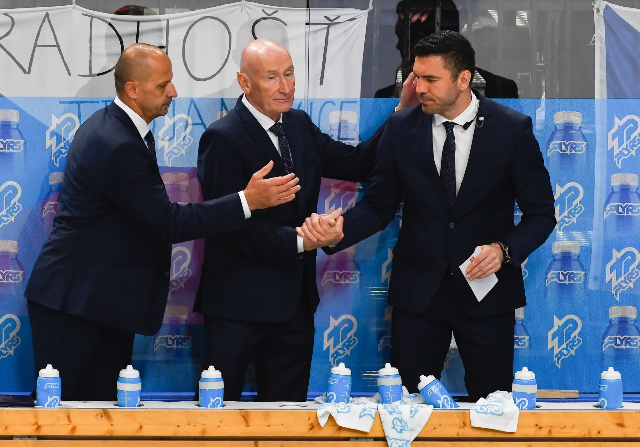 Na snímke zľava asistent hlavného trénera Ján Pardavý, tréner hokejistov Slovenska Craig Ramsay a asistent trénera Peter Frühauf.