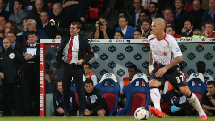 Futbalista Liverpoolu Slovák Martin Škrtel (vpravo) a bývalý tréner Brendan Rogers