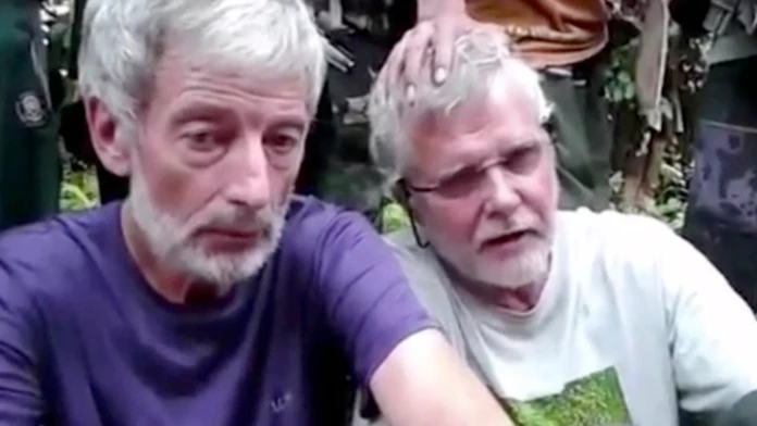 Dvaja unesení kanadskí občania John Ridsdel (vpravo) a Robert Hall. 