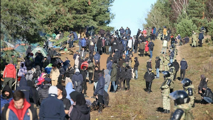 Utečenci na poľsko-bieloruskej hranici.