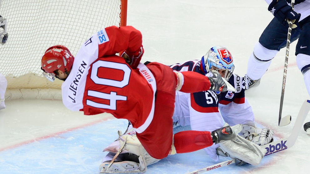 Na snímke brankár Slovenska Ján Laco  a vľavo Jesper Jensen z Dánska.